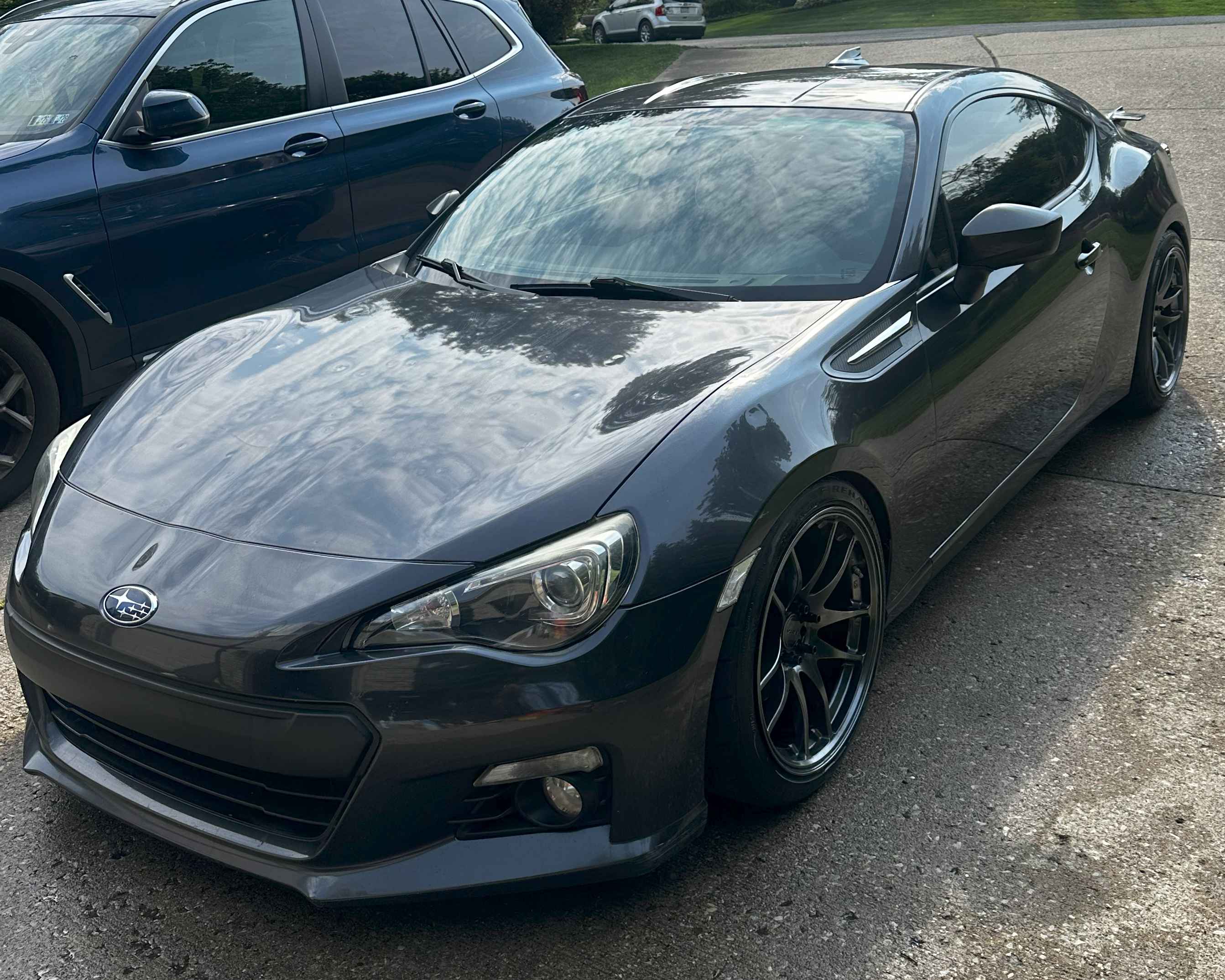 Detailed black Subaru BRZ with mirror-like finish showcasing premium exterior detailing